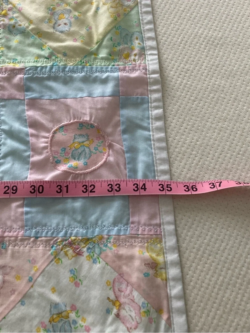 Handmade pastel kitten print baby quilt